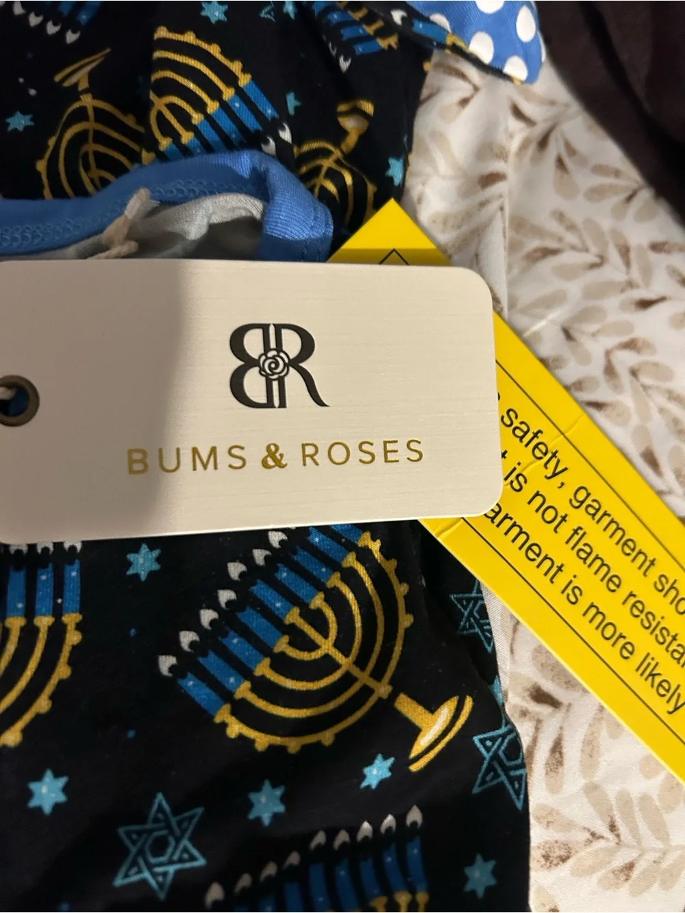 Ruffle Butts Navy & Gold Menorah Footed Pajamas for Kids